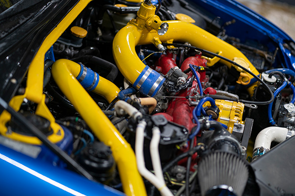 a-beautiful-turbo-sport-car-engine-bay-with-yellow-2023-11-27-05-10-12-utc